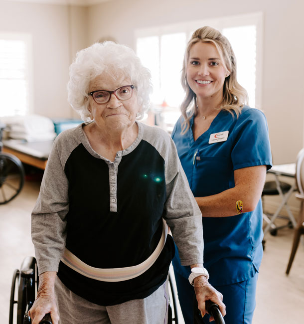 Elder being assisted with physical therpy at The Green House Cottages of Belle Meade